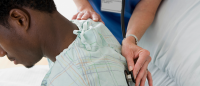 Patient examined by doctor.